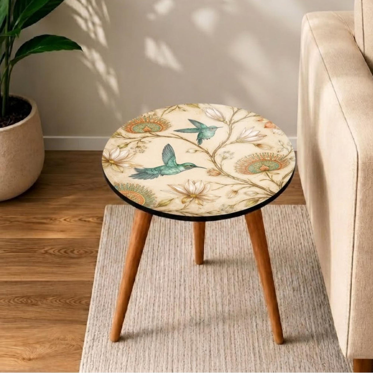 Top view of the hummingbird print round side table, glossy lacquer, showing the printed design.