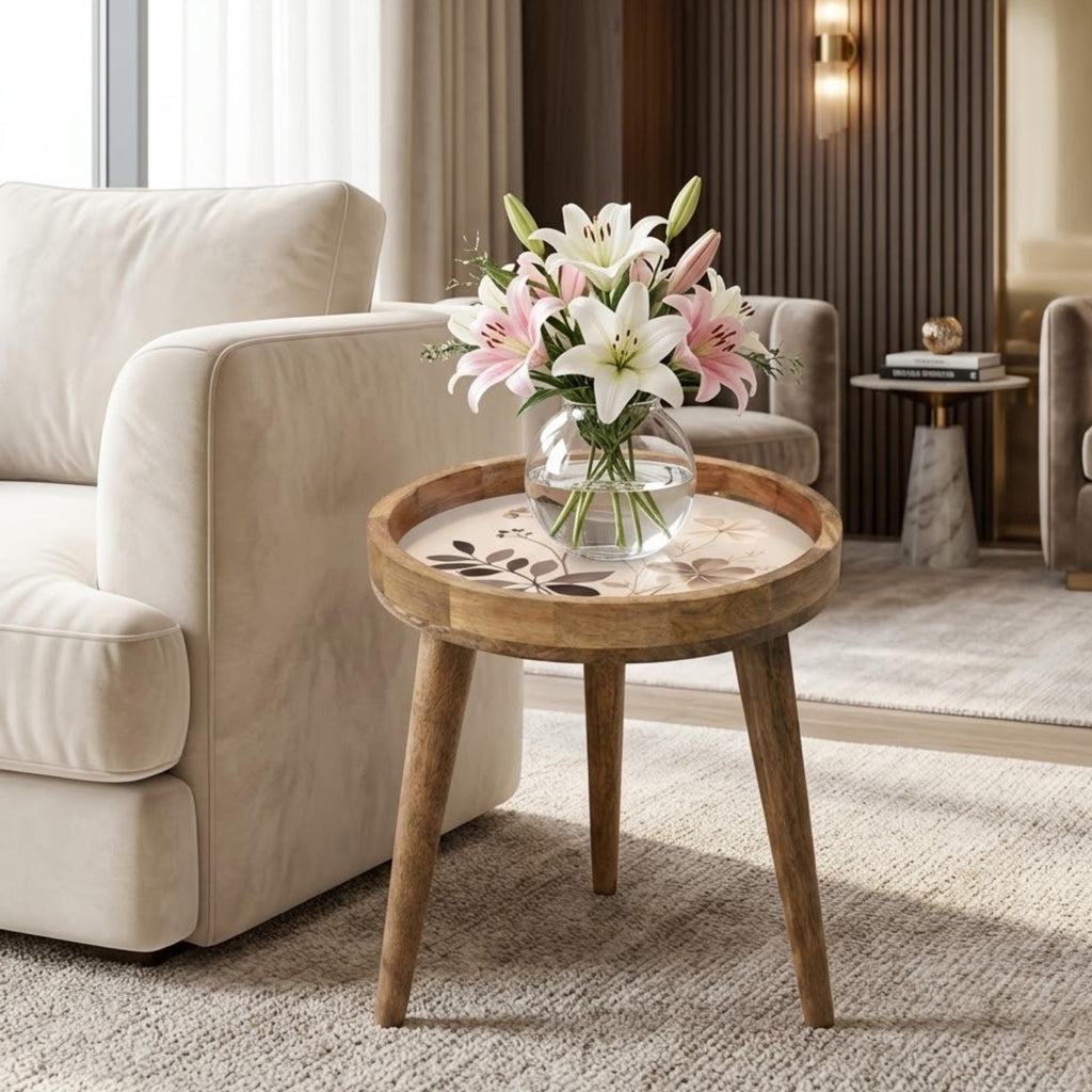 Neutral Botanical Mango Wood Side Table, shown beside a sofa in a styled room.