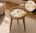Hummingbird Glass-Top Mango Wood Side Table, styled in a room with an inset showing the printed artwork.