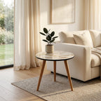 Abstract Wave Round Side Table, Glossy Lacquer, shown beside a sofa in a styled room.