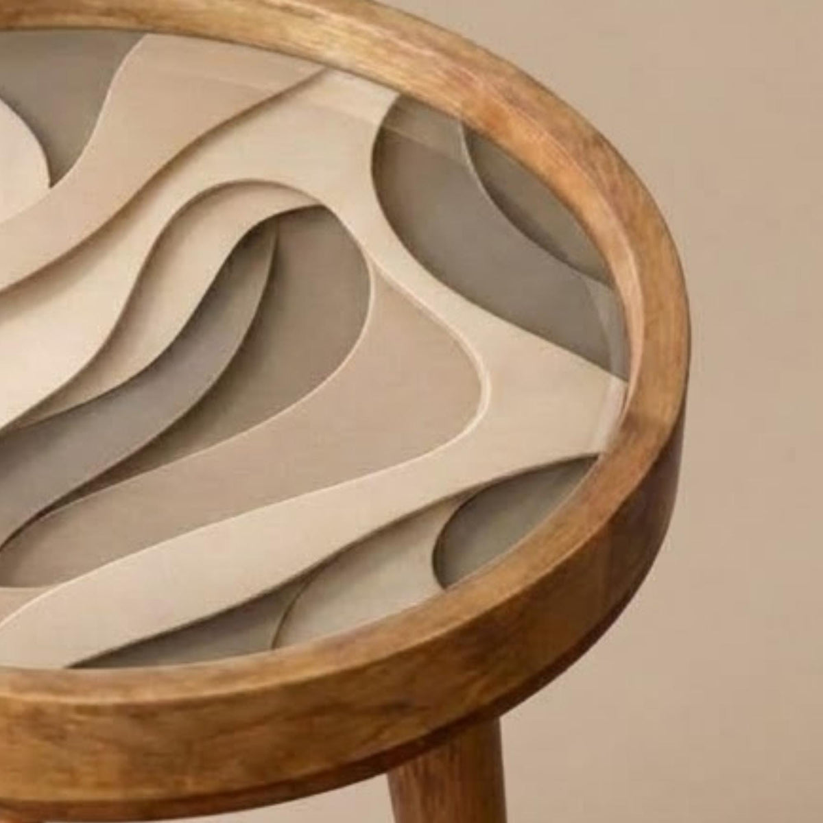 Close-up of the printed design on the neutral abstract mango wood side table.
