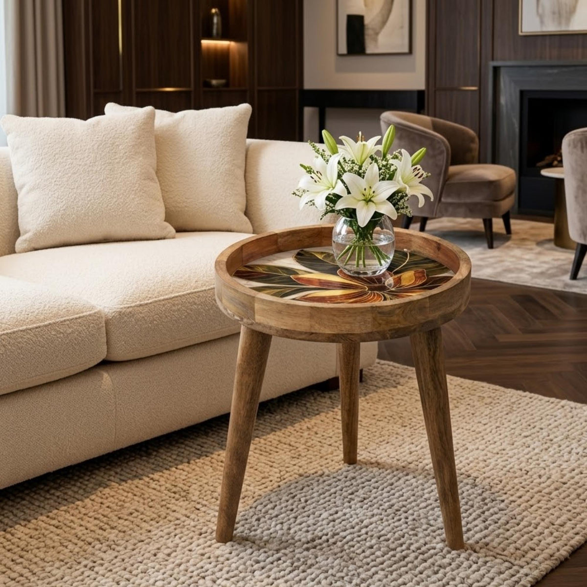 Floral Print Mango Wood Round Side Table, shown beside a sofa in a styled room.