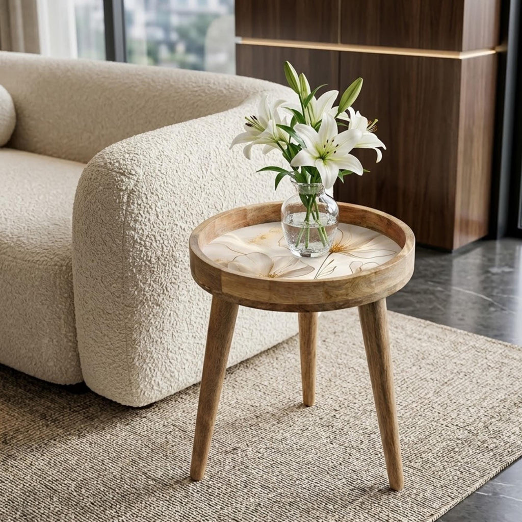 White Floral Print Mango Wood Side Table, shown beside a sofa in a styled room.
