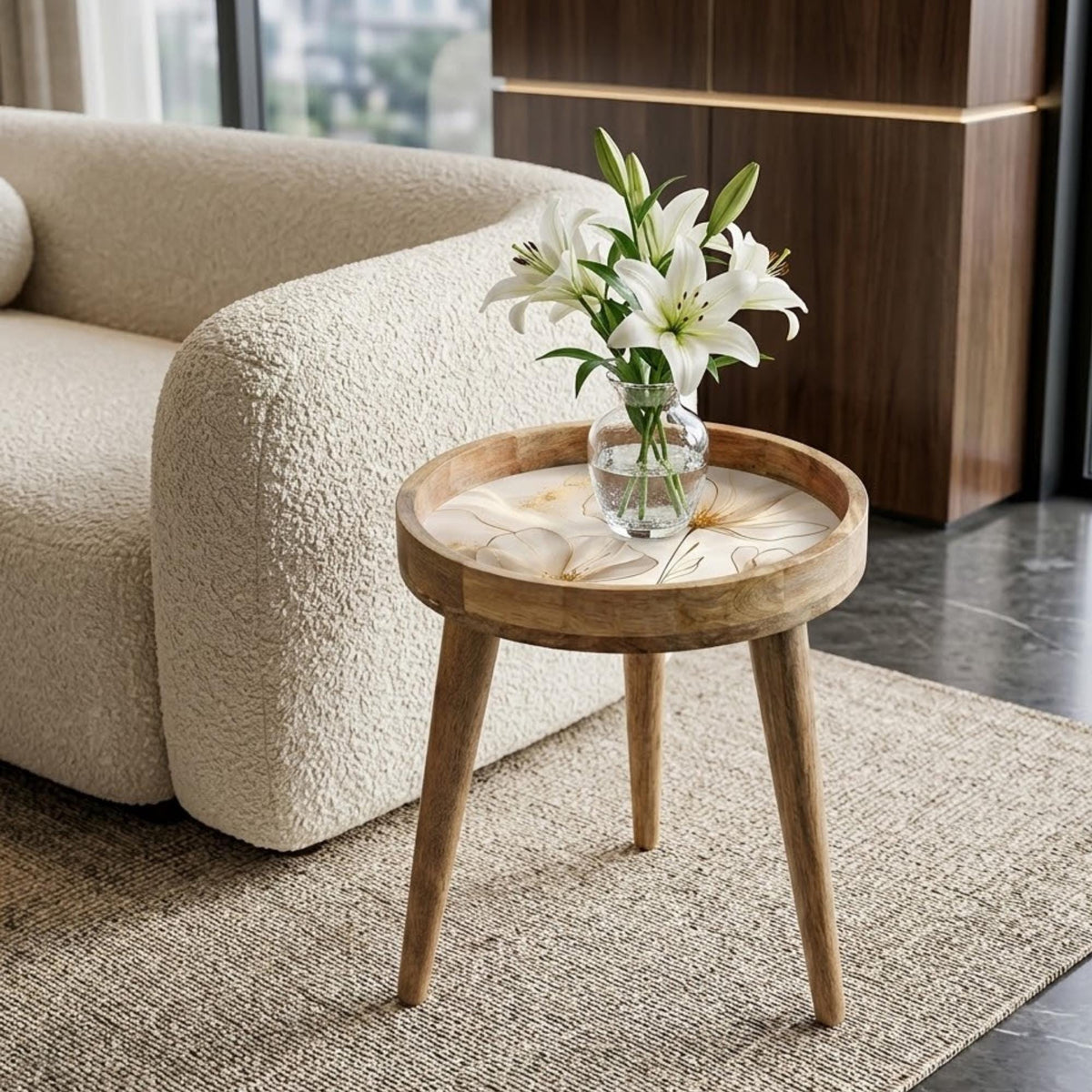 White Floral Print Mango Wood Side Table, shown beside a sofa in a styled room.