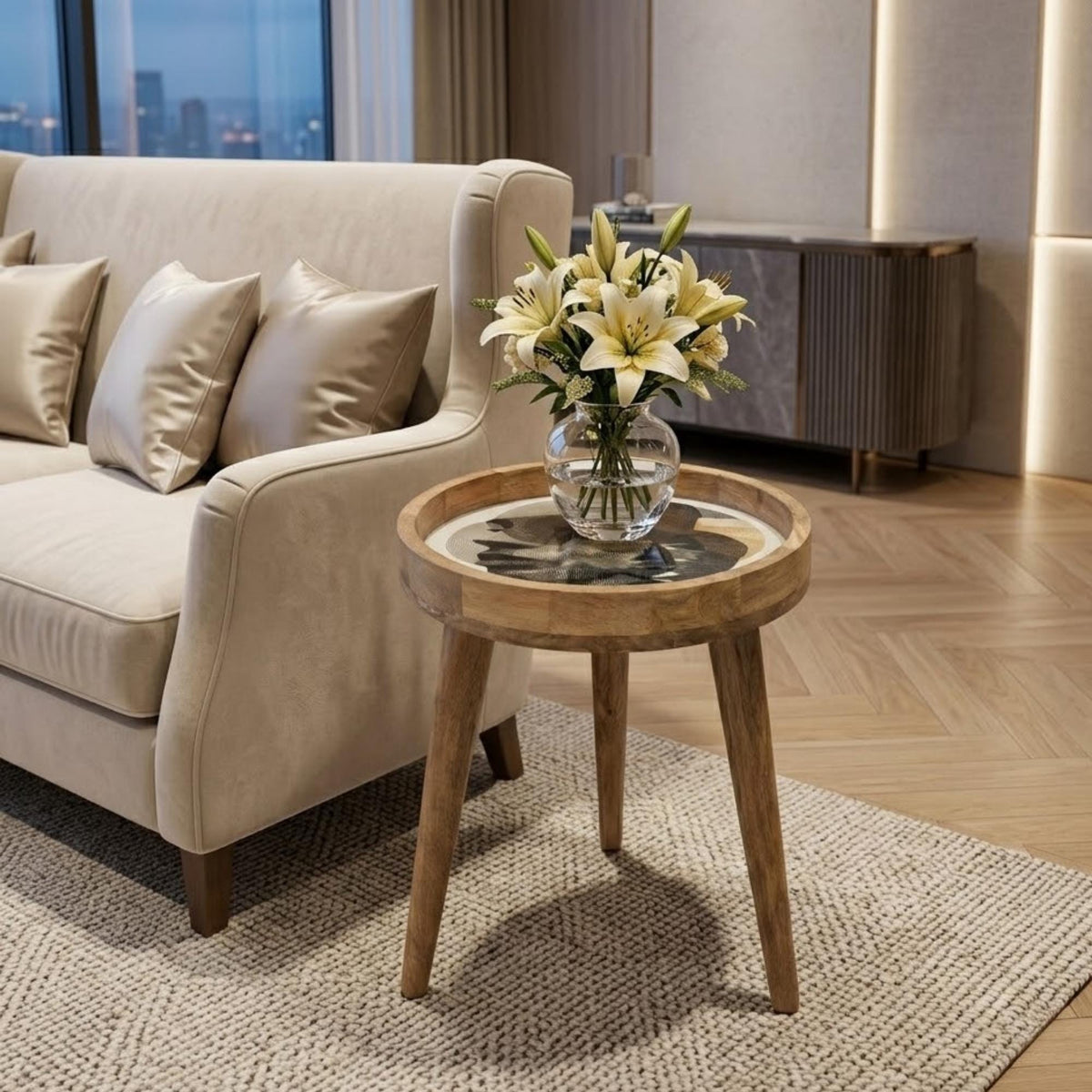 Abstract Face Mango Wood Side Table, shown beside a sofa in a styled room.