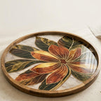 Angled view of the leaf & floral mango wood serving tray.
