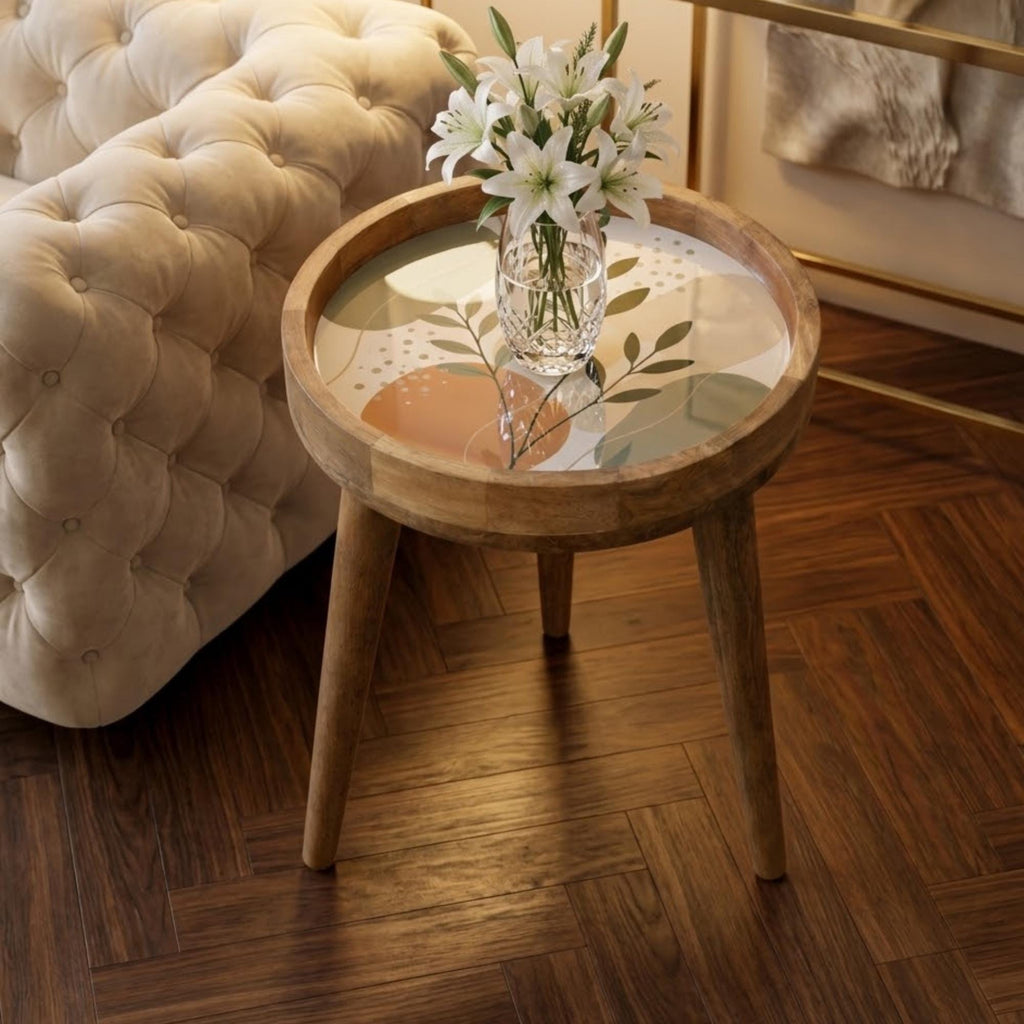 Minimal Botanical Mango Wood Side Table, shown beside a sofa in a styled room.